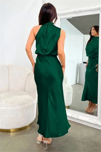 Detail of elegant dark green satin halter dress with smooth texture and zipper back