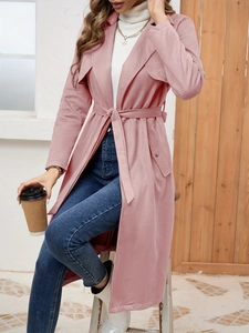 Detail of light pink faux suede trench coat with waistband and soft brushed texture