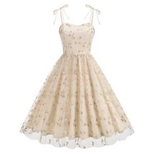 Close-up of floral embroidery on beige mesh tulle vintage A-line party dress