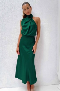 Detail of elegant emerald green satin sleeveless dress with gathered high neckline and silk texture