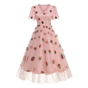 Detail of pink strawberry sequin embroidery on mesh tulle layer of A-line vintage dress