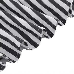 Hepburn style black and white striped cocktail dress with layered hem and cotton blend fabric