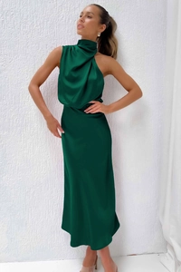 Close-up of elegant emerald green satin midi dress with cowl neck detail and smooth texture