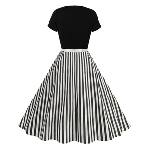 Vintage 1950s Audrey Hepburn swing dress with black bodice and striped A-line skirt back view