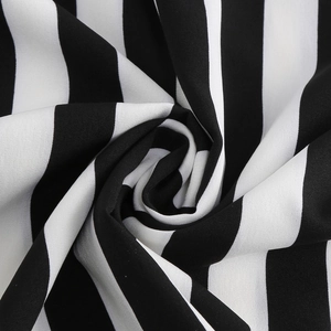 Close-up detail showing the soft drape and texture of black and white striped fabric