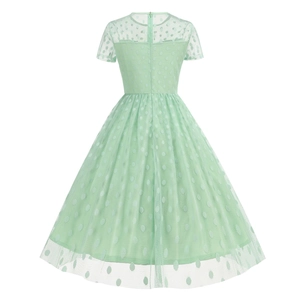 Detailed back view of a mint green 1950s retro polka dot cocktail dress with tulle overlay