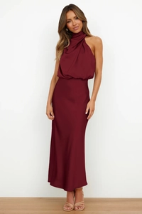 Detail of burgundy satin halter neck sleeveless dress featuring elegant pleated collar