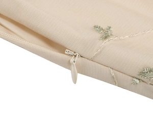 Detailed view of embroidery pattern and invisible zipper on mesh lace vintage dress