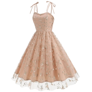 Close-up of floral embroidery on vintage apricot mesh dress with ribbon straps