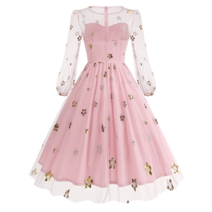 Detailed back view of a pink tulle dress featuring golden sequin stars and a hidden zipper