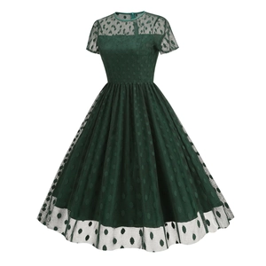 Detail of vintage dark green polka dot mesh fabric and fine craftsmanship on the sleeve
