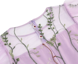 Detailed embroidery of floral vines and hidden zipper on purple mesh dress detail