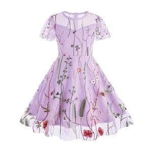 Close-up of colorful floral embroidery on purple tulle mesh fabric of a girl's dress