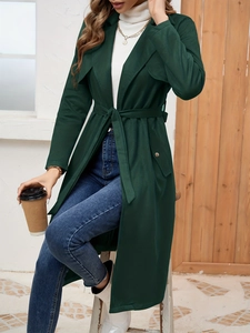 Elegant dark green suede trench coat with belted waist and double lapel for women