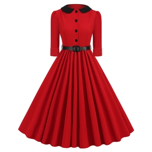 Detail of red vintage 1950s dress with black Peter Pan collar and waist belt