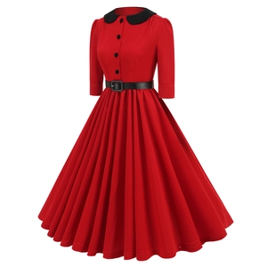 Detail of vintage red dress featuring black Peter Pan collar and matching waist belt