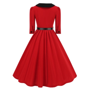 Detail of red vintage Audrey Hepburn dress with black collar, buttons and matching belt