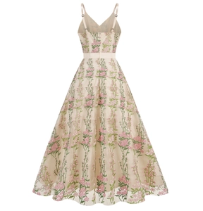 Close-up of floral embroidery on a vintage V-neck mesh maxi dress in cream white