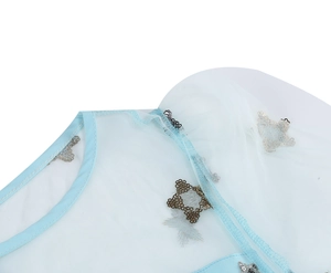 Detail of light blue mesh fabric with shiny star sequins and round neckline craft