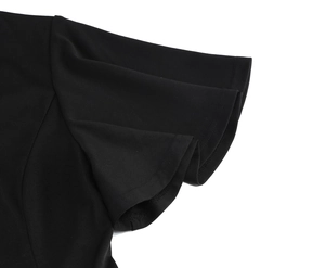 Close-up of elegant double-layered ruffle cap sleeves on a black cocktail dress