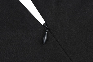 Detail of high-quality invisible zipper on black mesh embroidery cocktail dress fabric
