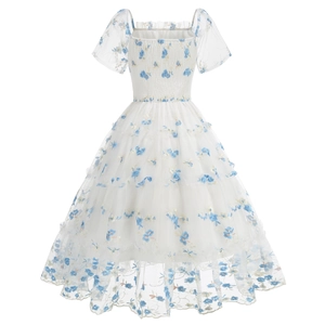 Detailed view of floral embroidery on a white mesh tulle vintage tiered party dress
