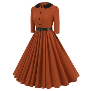 Detail of vintage caramel dress with black Peter Pan collar and pleated A-line skirt