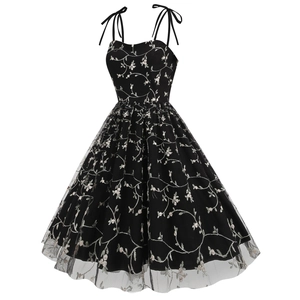 Detailed view of floral embroidery on vintage black mesh evening dress with bow straps