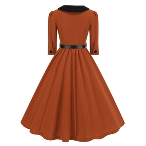 Rear view of vintage orange dress with black peter pan collar and adjustable waist belt
