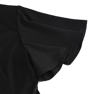 Detail shot of black 50s cocktail dress showing flutter sleeves and woven texture