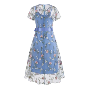 Detailed view of sky blue mesh dress featuring pink floral embroidery and satin waist ribbon