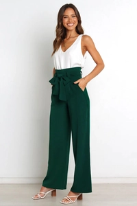 Detail of high waisted wide leg trousers with a self-tie bow belt and white V-neck top
