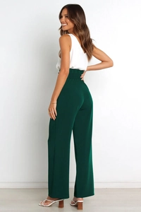 Detail view showing high waist pleated dark green wide leg trousers with smooth drape fabric