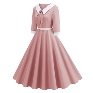 Detail of elegant pink A-line dress featuring white navy collar and delicate waist belt