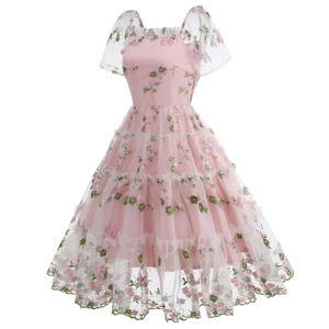Close-up of floral embroidery on pink mesh tiered dress with puff sleeves and square neck