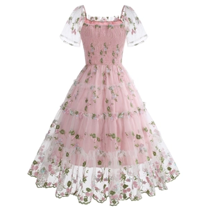 Detail of floral embroidery on pink mesh puff sleeves and ruffled layered cake dress