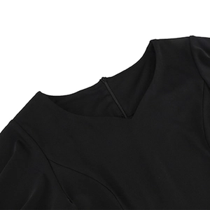 Detail of elegant black dress showing V-neckline and durable metal zipper closure