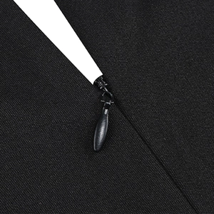 Macro shot of invisible drop-shaped metal zipper on black twill mesh cocktail dress
