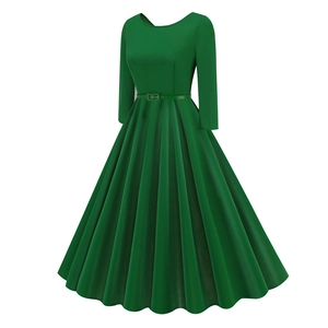 Detail view of dark green retro A-line dress with pleated skirt and matching slim belt