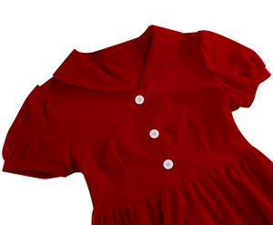 Detail of vintage dark red dress showing Peter Pan collar and white buttons