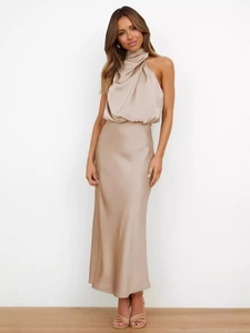 Elegant champagne satin two-piece set featuring a halter neck top and high waist maxi skirt