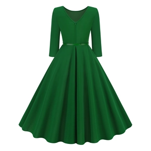 Rear view of green vintage A-line dress featuring three-quarter sleeves and hidden zipper