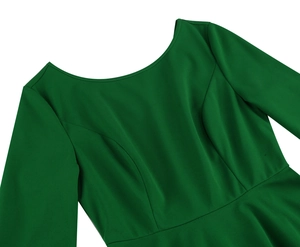 Detail of boat neck design and textured dark green fabric on elegant midi dress