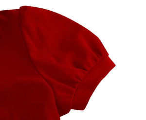Close-up of deep red puff sleeves with elegant pleated details on summer dress fabric