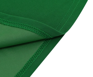 Detailed macro view of emerald green chiffon fabric showing professional neat inner stitching