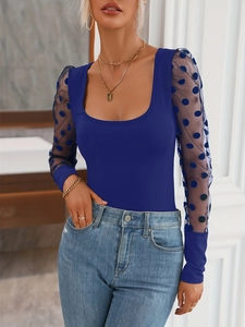 Women's navy blue U-neck knit top with sheer polka dot mesh long sleeves and slim fit