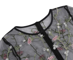 Detail of floral embroidery on black mesh dress with high-quality invisible zipper