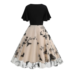 Detailed back view of a retro 50s cocktail dress with butterfly embroidery and mesh layers