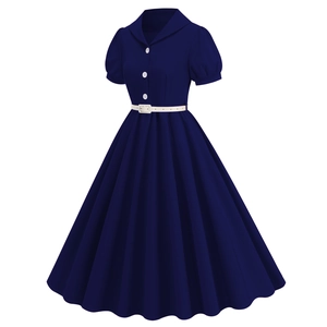 Detail of vintage navy blue dress featuring a Peter Pan collar and white belt accessory