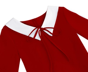 Detailed close-up of a vintage red dress featuring a white Peter Pan collar and bow tie